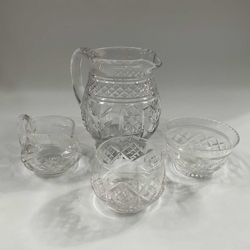 148D - A Tudor Crystal cut crystal water set, comprising jug and eight baluster stemmed drinking glasses, t... 