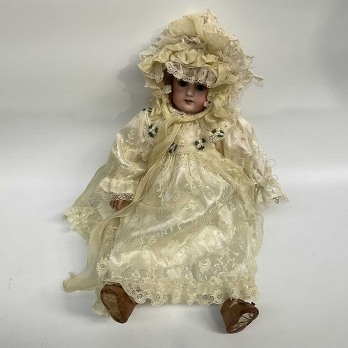 151B - A French bisque head doll, sleeping brown eyes, painted open mouth and exposed teeth, composite join... 