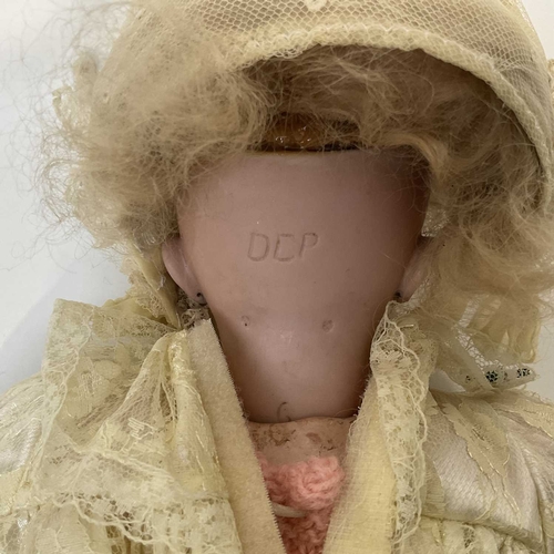 151B - A French bisque head doll, sleeping brown eyes, painted open mouth and exposed teeth, composite join... 