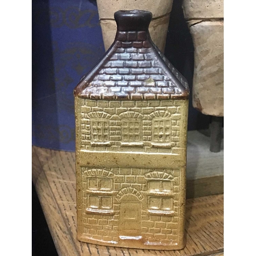 152B - A reproduction salt glazed stoneware flask in the form of a house, impressed R mark, 15cm high