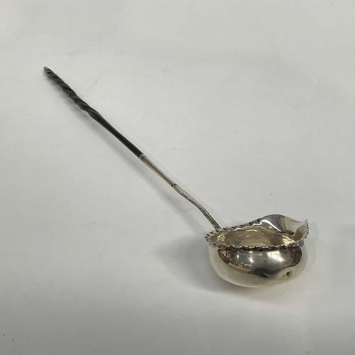 154C - A George III silver mounted toddy ladle, London 1771, shaped spout, with twisted whale bone handle, ... 