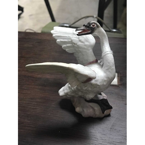 157D - A Meissen porcelain figure of a swan, modelled with wings outstretched (A/F), with ribbon tied wings... 