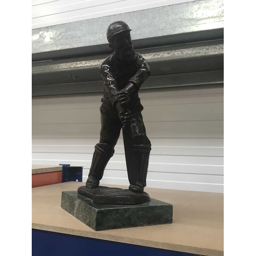 159A - A bronze figure of the cricketer W.G. Grace, mounted on marble plinth, 29cm high