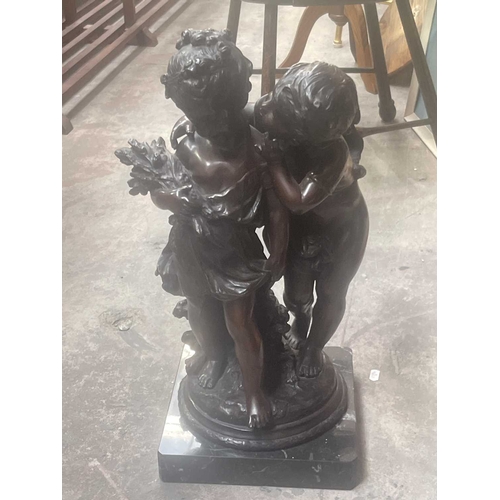 159E - After Moreau, a bronze figure group depicting a young girl and boy, on circular naturalistic base an... 