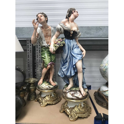 162 - A large pair of Capodimonte figures, modelled as peasants, 63cm high (2)