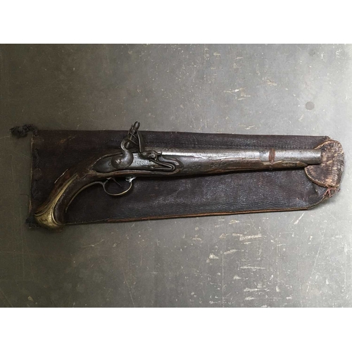 174 - An 18th century flintlock pistol, 10 inch engraved barrel, brass buttplate and trigger guard