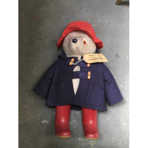 176 - A Gabrielle Designs Paddington bear, with blue duffel coat, red hat, wellingtons and label