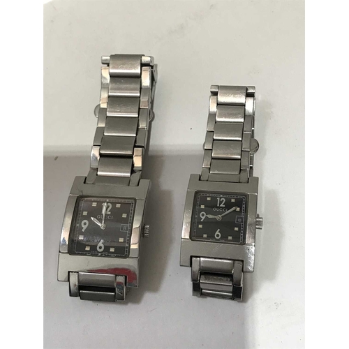 231 - Gucci, His and Hers stainless steel wristwatch pair, black square dials on chainlink bracelet straps... 