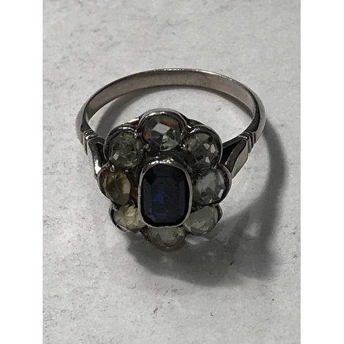 248 - A sapphire and white stone cluster ring, set on white metal, 3.44g