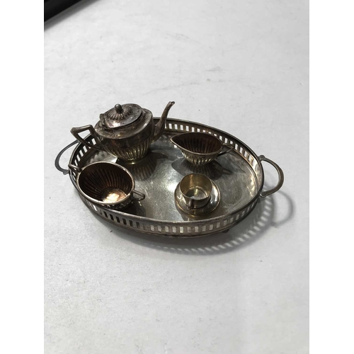 258 - A George IV silver miniature teaset and tray, Saunders and Shepherd, Birmingham 1912, half reeded bo... 