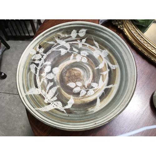 274 - A Studio Pottery charger, foliate swirling design, impressed marks, 43cm diameter