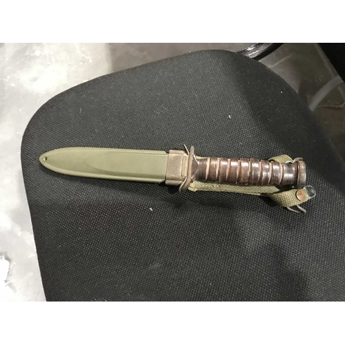 286 - A US military knife in scabbard, USM8