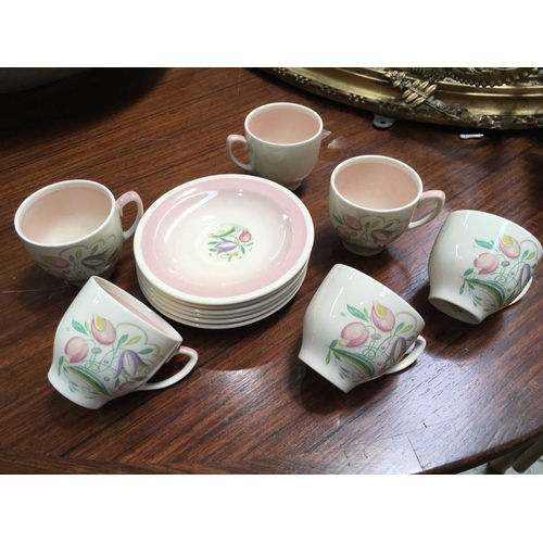 298 - Susie Cooper, a set of six Burslem tea cups and saucers, floral decoration, printed marks (12)