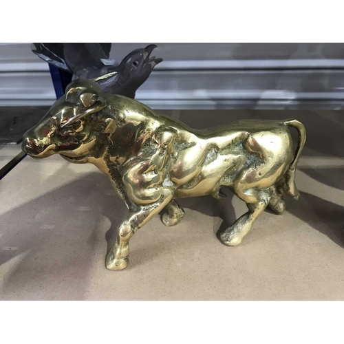 307 - A brass or bronze model of a bull