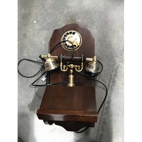 313 - An antique style wall mounted telephone