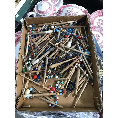 321 - A collection of turned wooden and beaded lace bobbins