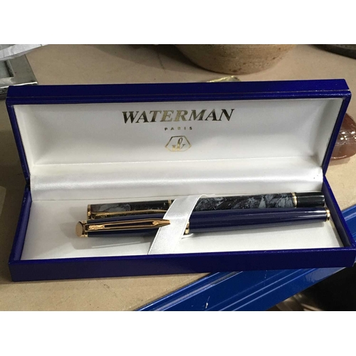 348 - Waterman, a Laureat marbled fountain pen and a Hemisphere fountain pen, blue lacquer, gold plated ni... 