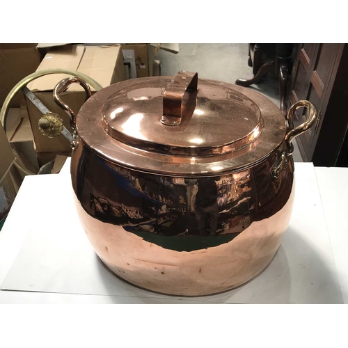 394 - A Victorian large twin handled copper boiling pot and cover, ovoid form, the stepped lid with angled... 