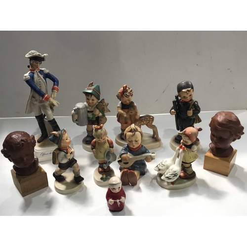 397 - A collection of Hummel for Goebels figurines, a pair of Goebel terracotta bust portraits, a Goebel f... 