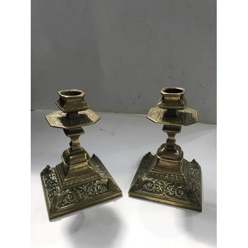 410 - A pair of late Victorian brass candlesticks, short square form, with plateau knop and shaped stem, e... 