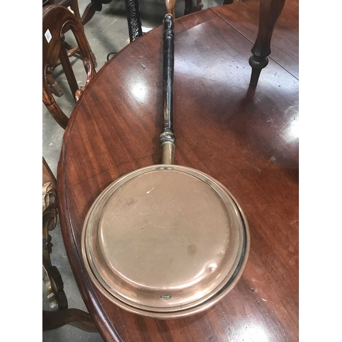 424B - A Victorian copper warming pan, on turned wooden handle