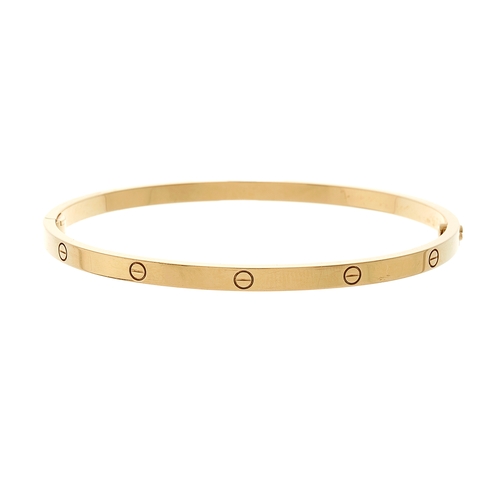 Cartier an 18ct gold Love bangle bracelet with screw head motif