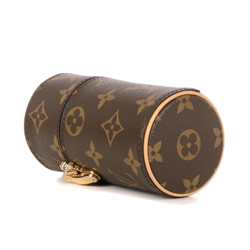 Louis Vuitton, a monogram perfume travel case, designed in a cylindrical  shape with the maker's sign