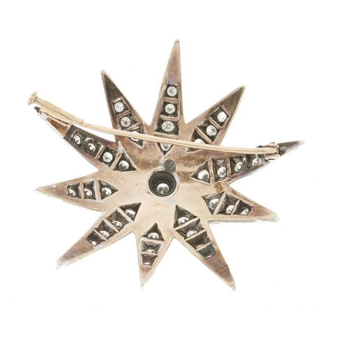 115 - A large silver and gold, brilliant-cut diamond star brooch, estimated total diamond weight 2.80ct, p... 