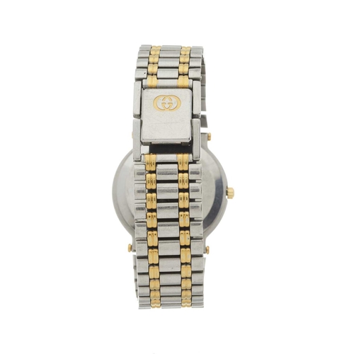 360 - Gucci, a stainless steel and gold plated 9000M bracelet watch, diamond set black dial, reference 900... 