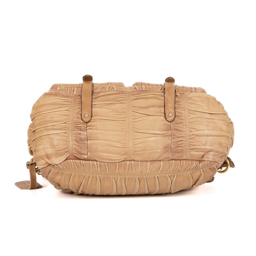 Prada, a leather Gaufre messenger bag, crafted from tan deerskin