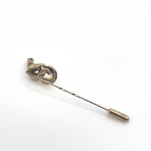 10 - A 9ct gold stick or tie pin with coiled cobra finial, set sapphire, hallmarked, 3.7g