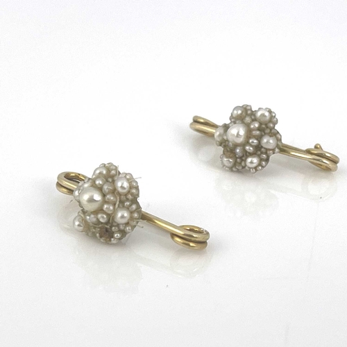 14 - A pair of Victorian natural pearl cluster brooches, on yellow metal safety pins, 3cm long, 4.87g (2)