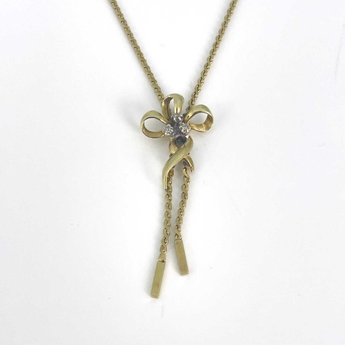 16 - A gold bow pendant necklace, set with three small diamonds, on a fine chain, 6.5g