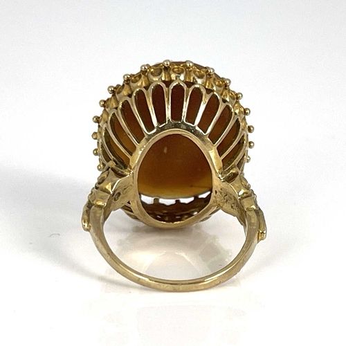 21 - A 9ct gold ring set with an oval cameo depicting a bust portrait of a lady, ring size Q, 8.4g