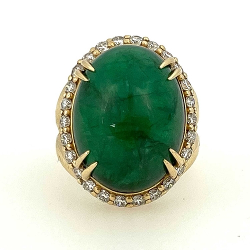 22 - A large cabochon emerald and diamond cluster ring, 14 carat gold, the central green stones within a ... 