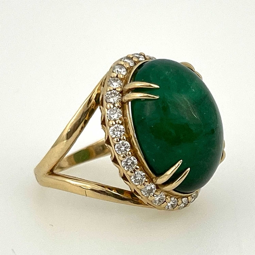 22 - A large cabochon emerald and diamond cluster ring, 14 carat gold, the central green stones within a ... 