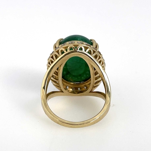 22 - A large cabochon emerald and diamond cluster ring, 14 carat gold, the central green stones within a ... 