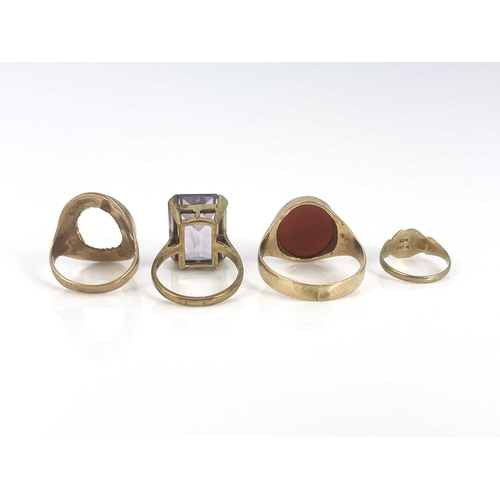 28 - Four gold rings, including carnelian signet ring, amethyst and other signet rings, ring sizes: Z 1/2... 