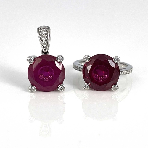 29 - A 14k gold pendant and ring, each set synthetic ruby inset with three white stones, ring size N 1/2 ... 