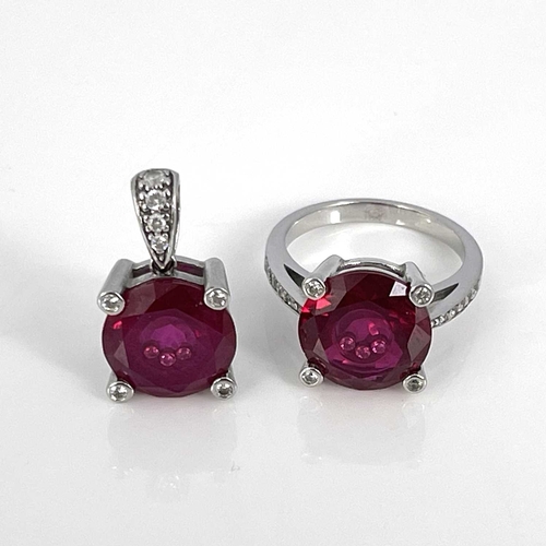 29 - A 14k gold pendant and ring, each set synthetic ruby inset with three white stones, ring size N 1/2 ... 