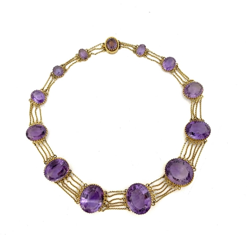 30 - A Victorian amethyst and yellow metal necklace, circa 1860, the thirteen graduated facet cut stones ... 