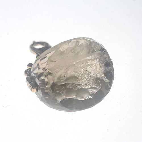 34 - A mid-19th Century gold mounted triple facet cut quartz intaglio swivel fob seal, 4cm high