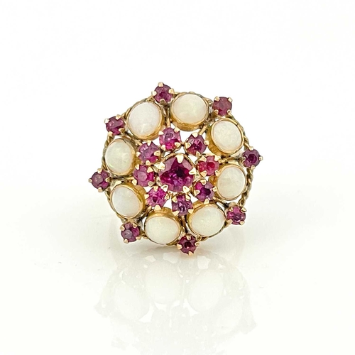 35 - An 18k gold opal and ruby cluster ring, ring size Q 1/2, 5.8g