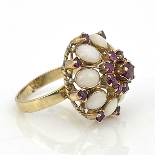 35 - An 18k gold opal and ruby cluster ring, ring size Q 1/2, 5.8g