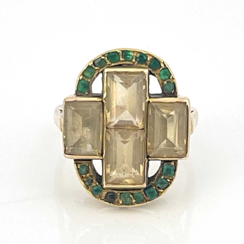 37 - A yellow gold four-stone topaz ring with an emerald set border, with a pair of gilt metal vase-shape... 