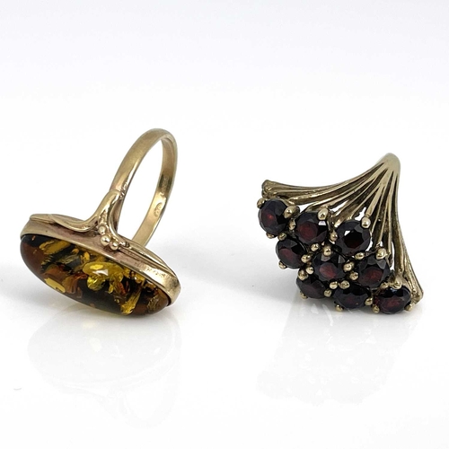 38 - A 9ct gold garnet cluster ring and a 9ct gold amber ring, ring sizes: P/P 1/2 and M 1/2, 7.2g (2)