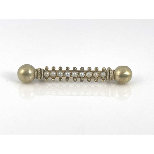 42 - An Etruscan revival yellow metal and split pearl bar brooch, double ended baton form with spherical ... 