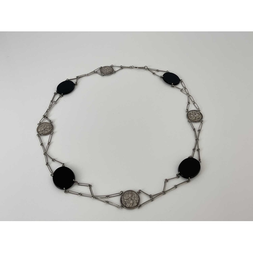 51 - An Art Nouveau white metal and onyx belt or necklace, alternating plaques of relief cast maiden and ... 