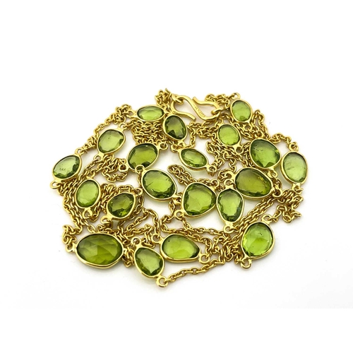 62 - Kristina Charrington, a silver gilt peridot necklace, collet set twenty graduated oval peridot