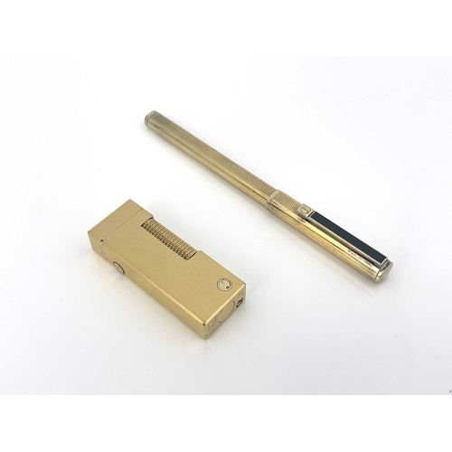 67 - Dunhill, a gold-plated lighter in the presentation box and a Dunhill gold-plated pen (2)